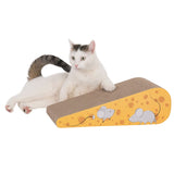 Scratching board in cheese shape with mouse motifs, made of cardboard. White cat lying relaxed next to it.