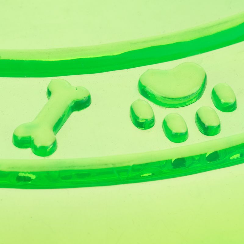 Green relief with bone, heart and paw motif, possibly decorative design for pet products.