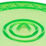 Green plastic toy with circular bumps and bone patterns on the edge, suitable for interactive play.