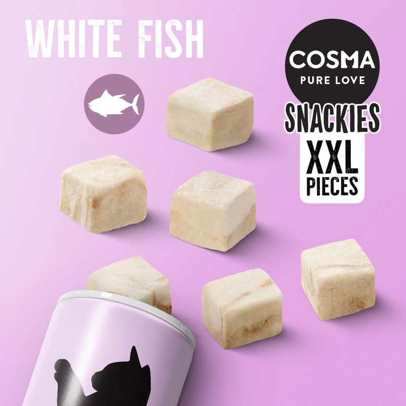 Cosma Pure Love Snackies XXL Pieces, white fish flavour, shown as large freeze-dried cubes with product name and flavour text on a purple background.