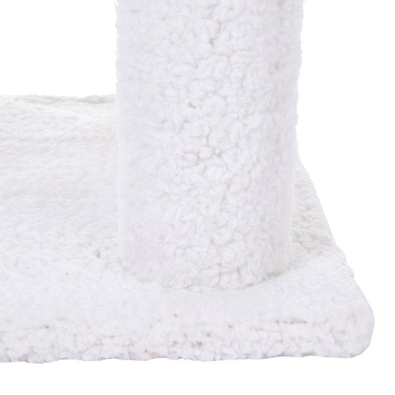 Close-up of white, fluffy fabric material on a square base and a vertical element.