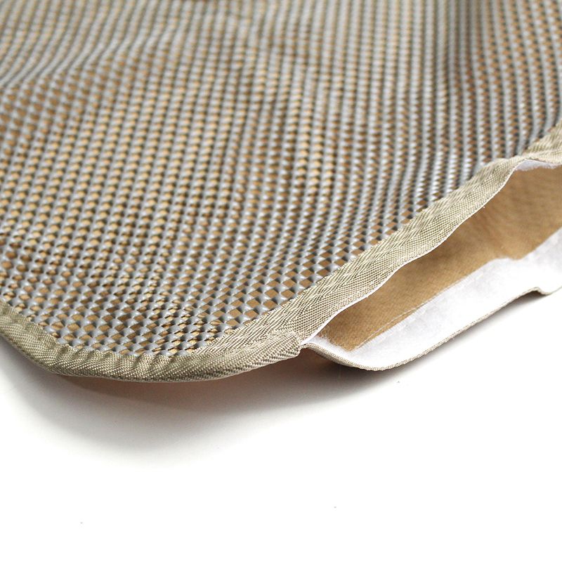 Close-up of a beige-patterned mat with non-slip underside and reinforced edge.