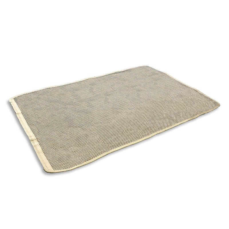 Rectangular beige mat with textured surface and rounded corners, suitable for various uses.