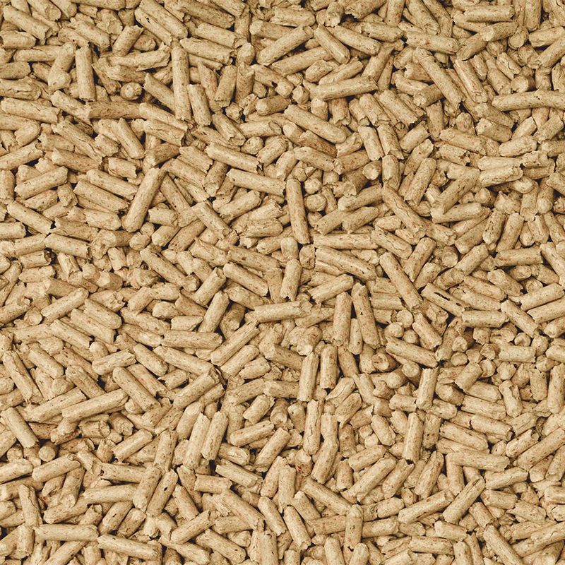 Close-up of brown pellets, possibly pet food or bedding. No further information visible.