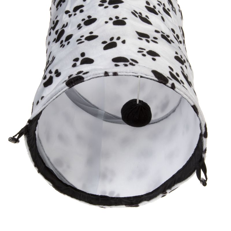 Toy tunnel made of white fabric with black paw patterns, grey material inside and a hanging black ball on a string.