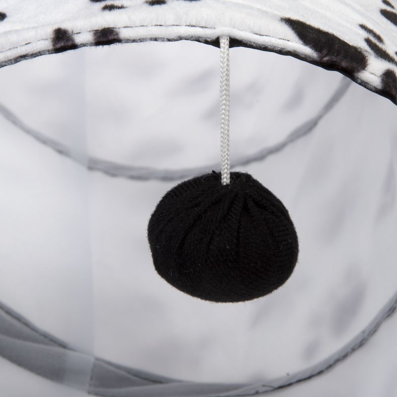 Black fabric play ball hanging on a white string, part of a pet toy design.