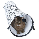 Play tunnel with paw pattern, white lined interior, hanging play ball. Cat sitting inside the tunnel.