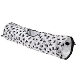 White play tunnel with black paw patterns, side entrance and hanging ball at the entrance.