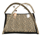 Play mat with leopard pattern, two crossed arches and hanging toys such as fabric ball and feather pendant.