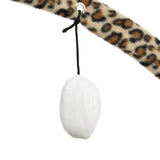 Toy made of white fabric, hanging from a leopard print arch with a black cord.