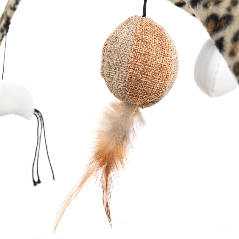 Toy made of jute with brown feathers, hanging from a leopard print stand.