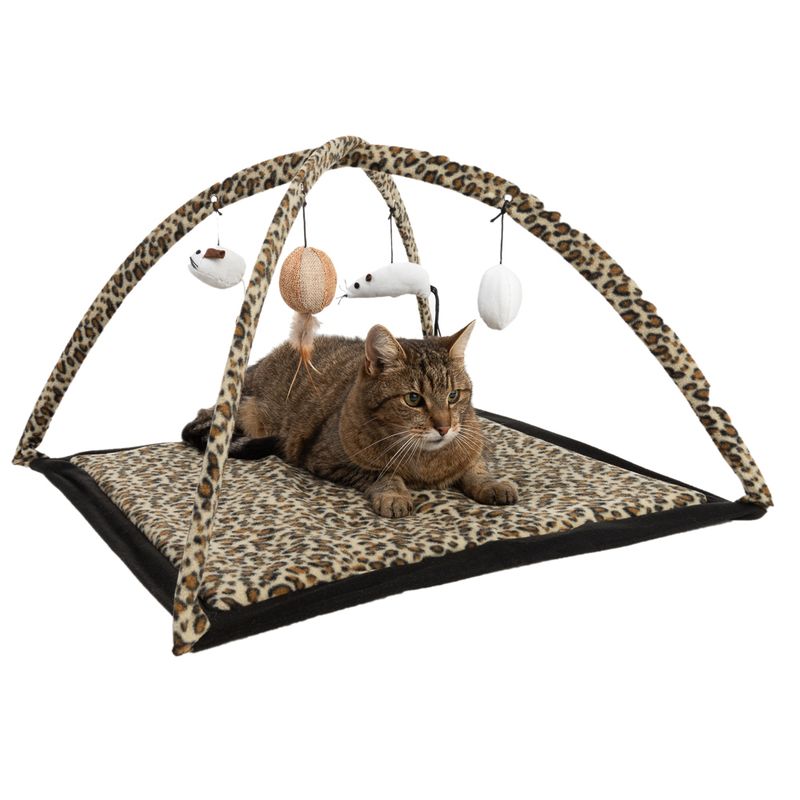 Play mat with leopard pattern and play arch, hanging toys such as mouse, ball and feather. Cat lying on the mat.
