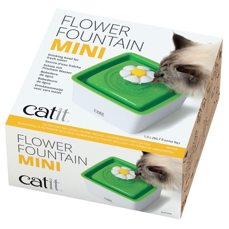 Catit Flower Fountain Mini, drinking fountain for fresh water with included filter, capacity 1.5 l. Shown: cat drinking from green fountain with flower attachment.