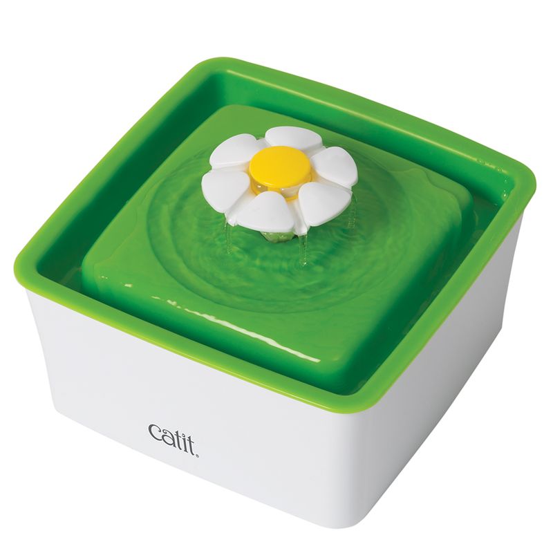 Catit drinking fountain with green basin and white-yellow flower as water outlet.