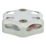 Interactive cat toy with holes and a feather inside that is visible.