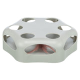 Toy for cats, grey plastic base with holes and pink feather inside.