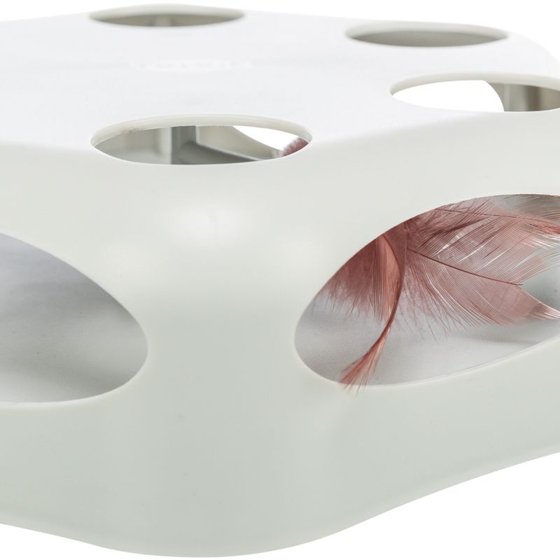 White cat toy with oval openings showing pink feathers.