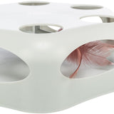 White cat toy with oval openings showing pink feathers.