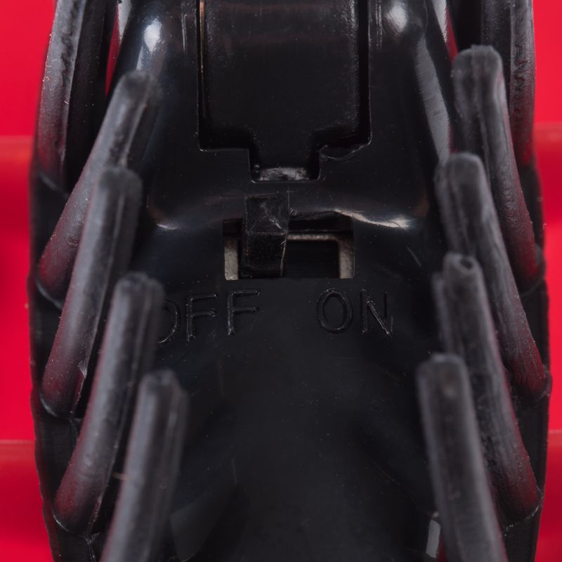 Close-up of a black switch with the labels 'OFF' and 'ON'.
