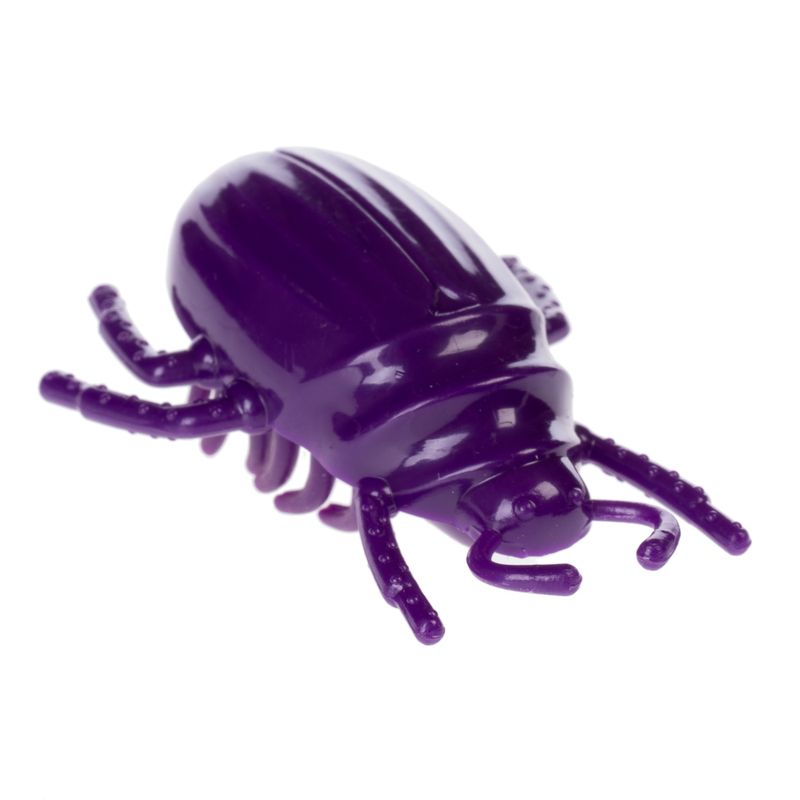 Purple plastic toy in the shape of a beetle with detailed legs and body structure.