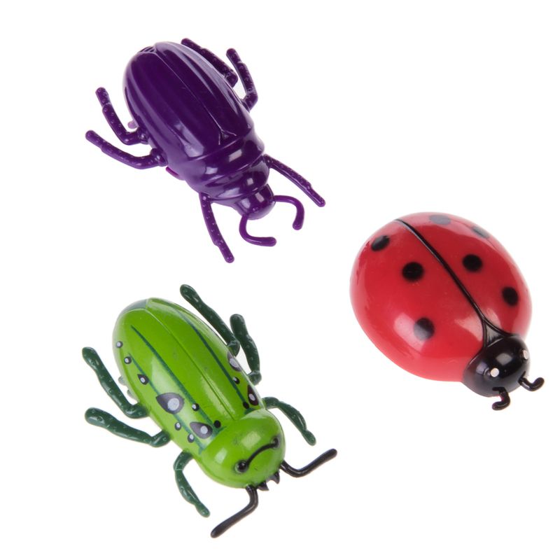 Three toy insects: green beetle, red ladybird with black spots, and purple beetle. Suitable as pet toy.