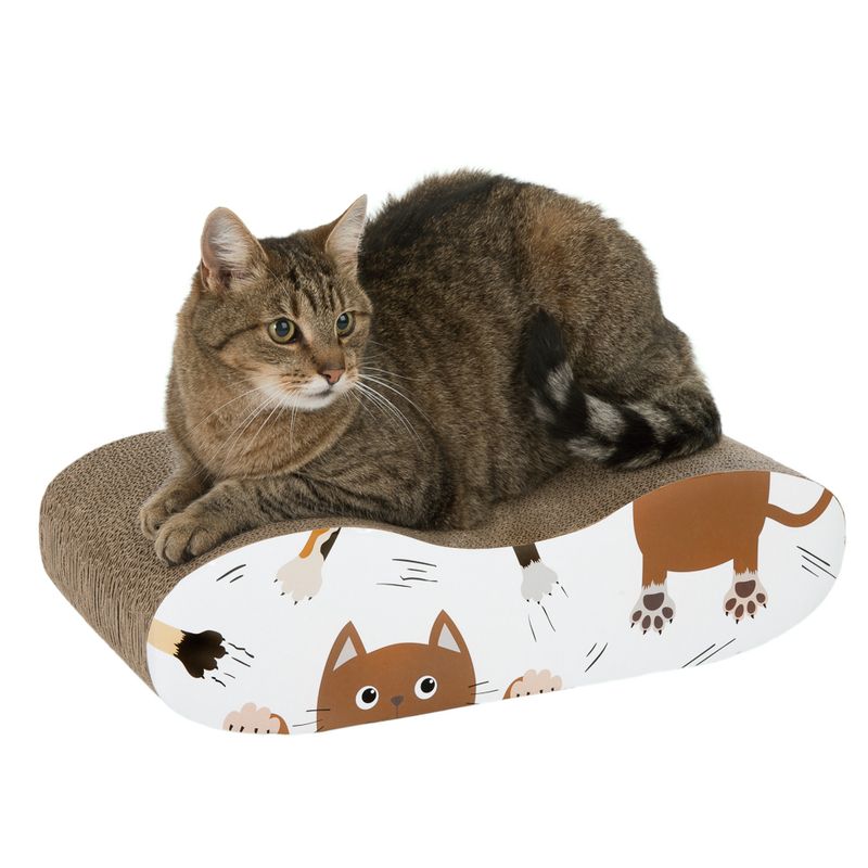 Cardboard cat lounger with colourful cat design, brown cat lying on it.