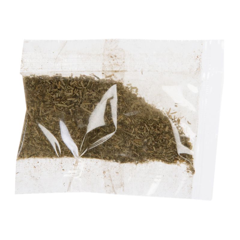 Transparent pouch with dried herbs, suitable for pet food or other uses.