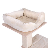 Cat tree with beige plush bed on a wooden platform and sisal-wrapped post, padded lying area underneath.