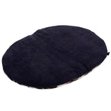 Oval, dark blue cushion with soft surface, suitable as a lying area.