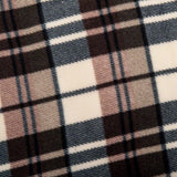 Close-up of a checked fabric pattern in brown, beige and grey tones.
