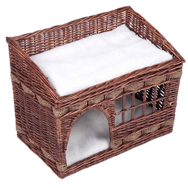 Braided basket made of brown rattan with white cushion, two levels and an entrance arch. Suitable as a sleeping place or hideaway for pets.