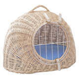 Round carrier basket made of light rattan with white metal grid and blue padded interior. Two white leather straps secure the grid.