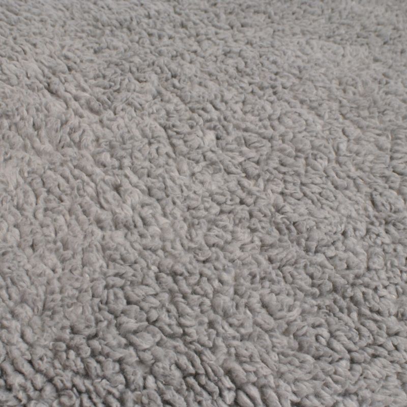 Close-up of grey, soft plush material with textured surface.