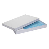 Rectangular white box with lid partially open, showing a blue speckled pad or insert inside. No branding or text visible.
