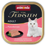 Animonda Vom Feinsten Adult with turkey hearts. Serving suggestion: pâté on black plate, white cat shown.