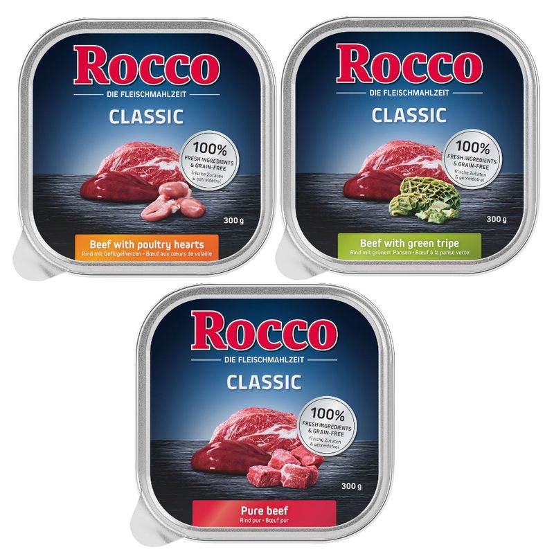 Three packs of Rocco Classic wet food: Beef with poultry hearts, Beef with green tripe, and Pure beef. Each pack states 100% fresh ingredients and grain-free, 300g.