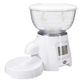 Trixie automatic feeder with transparent container, digital display and white food bowl.