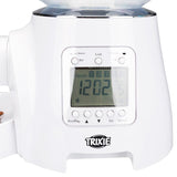 Trixie automatic feeder with digital display, shows time and number of meals. Controls for settings, recording and volume visible.