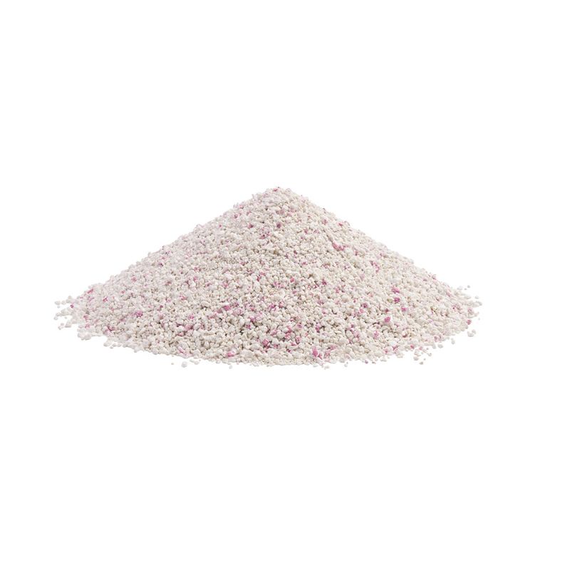 Pile of white granules with scattered pink particles, possibly cat litter or similar material.