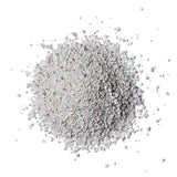 White, granular litter with green particles, suitable for use as cat litter.