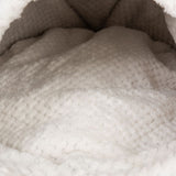 Close-up of soft, white plush material with textured surface, suitable for pet beds or blankets.