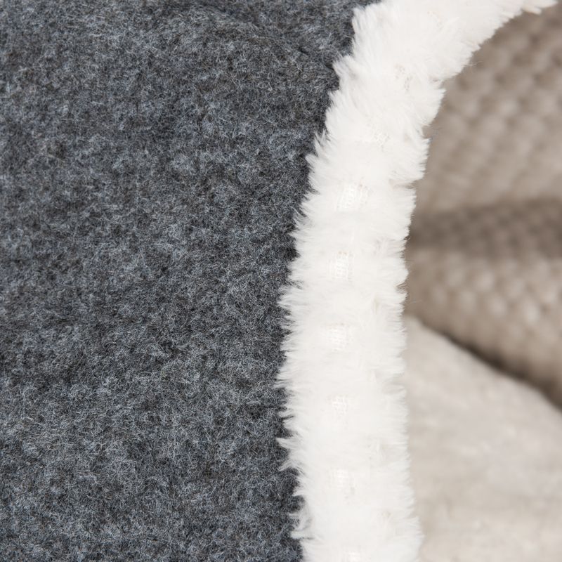 Close-up of grey felt material with white plush edge, suitable for pet products such as beds or caves.