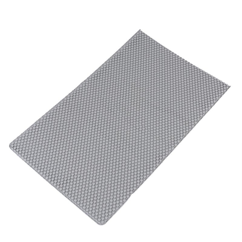 Grey mat with textured surface, rectangular shape.