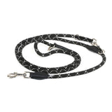 Black dog lead made of braided material with white accents and metal carabiners at both ends.