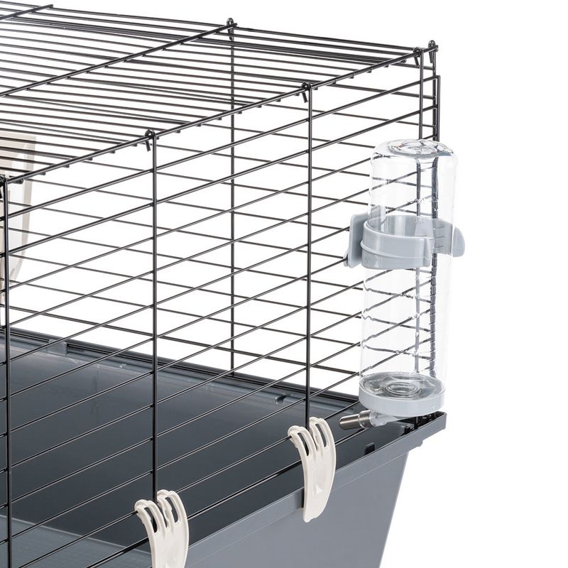Small animal cage with metal grid walls, plastic base and attached water bottle made of transparent plastic.