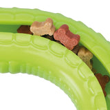 Green toy with bone-shaped treats in various colours, including red, brown and beige.