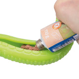 Green toy tube filled with paste-like food from a tube. Tube displays gluten-free symbol and weight of 110g.