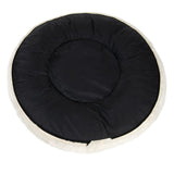 Round black padded mat with a light-coloured edge, shown from above to display its shape and surface texture.