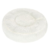 Round, white cuddly bed made of soft plush material with raised edge and padded lying surface.