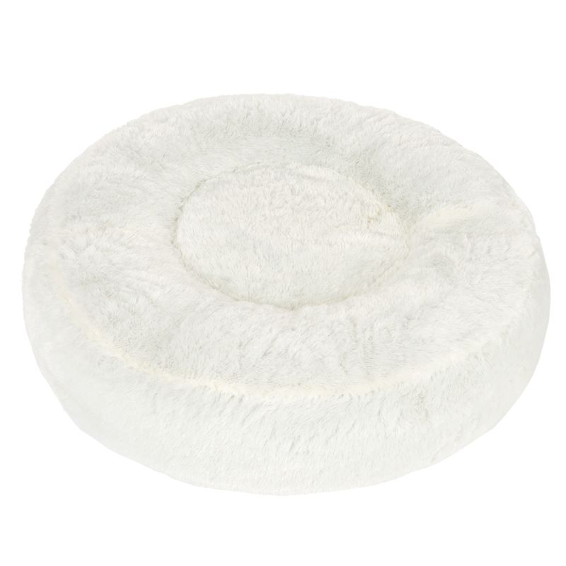 Round, white cuddly bed made of soft plush material with raised edge and padded lying surface.